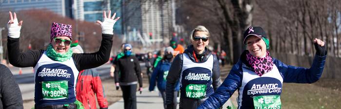 Participants walking along the lakefront