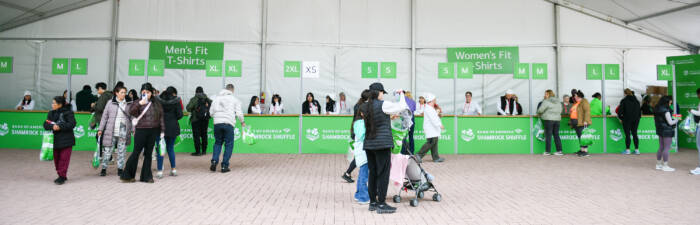 Volunteers and participant at Packet Pick-up for the Bank of America Shamrock Shuffle